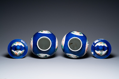 A pair of Chinese famille verte powder blue-ground vases and a fish bowl, 19th C.