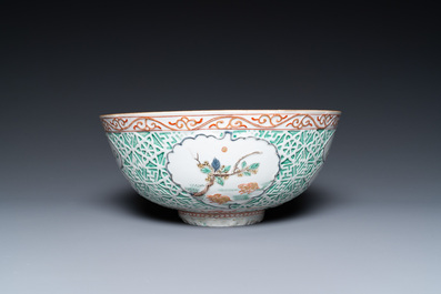 A Chinese famille verte relief-decorated bowl with squirrels and rabbits, Kangxi