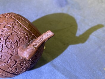 A Chinese Yixing stoneware teapot with boys among peony scrolls, Kangxi