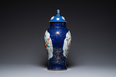 A Chinese blue-ground famille rose vase and cover, Kangxi mark, 19th C.