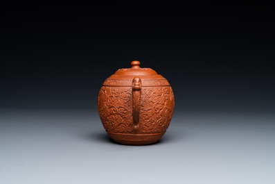 A Chinese Yixing stoneware teapot with boys among peony scrolls, Kangxi