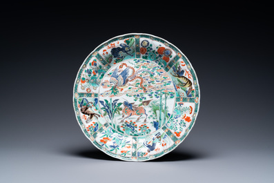 A pair of Chinese famille verte 'mythical animals' dishes, seal marks, Kangxi