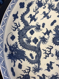 A massive Chinese blue and white 'dragon' dish, Kangxi mark, 19th C.