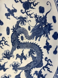 A massive Chinese blue and white 'dragon' dish, Kangxi mark, 19th C.