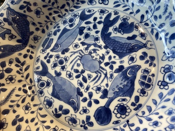 A pair of Chinese lobed blue and white 'fish' dishes, Kangxi