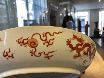 A Chinese iron red 'dragon' dish, Chenghua mark, Kangxi