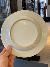 Une assiette en porcelaine de Chine &agrave; cama&iuml;eu pourpre &agrave; d&eacute;cor du 'Jeune p&ecirc;cheur' d'apr&egrave;s Abraham Bloemaert, Qianlong