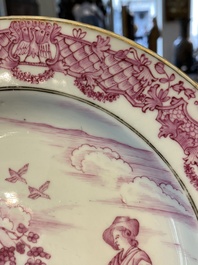 Une assiette en porcelaine de Chine &agrave; cama&iuml;eu pourpre &agrave; d&eacute;cor du 'Jeune p&ecirc;cheur' d'apr&egrave;s Abraham Bloemaert, Qianlong