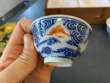 A pair of Chinese blue, white and iron-red cups and a yellow-ground 'dragon' dish, Guangxu mark and of the period