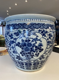 A large Chinese blue and white fish bowl with an eagle and magpies, 19th C.