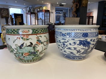 A Chinese blue and white 'dragons' fish bowl and a famille verte 'magpies' fish bowl, 19th C.