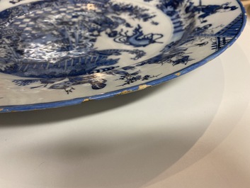 A finely painted and thin-walled large Dutch Delft blue and white chinoiserie dish, late 17th C.