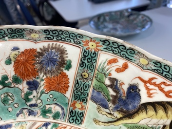 A pair of Chinese famille verte 'mythical animals' dishes, seal marks, Kangxi