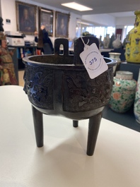 A Chinese bronze tripod censer with 'taotie' masks, Ming