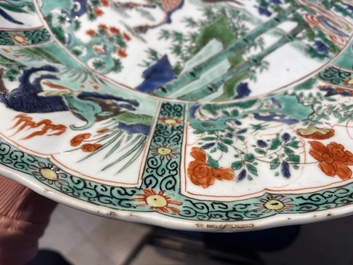 A pair of Chinese famille verte 'mythical animals' dishes, seal marks, Kangxi