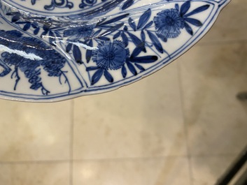 A pair of Chinese blue and white lobed 'phoenix and monkey' plates, Kangxi