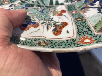 A pair of Chinese famille verte 'mythical animals' dishes, seal marks, Kangxi