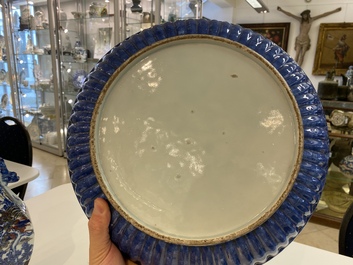 A Chinese ribbed blue and white dish with a scholar and his pupil, 19th C.