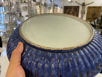 A Chinese ribbed blue and white dish with a scholar and his pupil, 19th C.