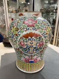 A pair of Chinese famille rose vases with wooden covers and stands, 19th C.