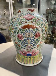 A pair of Chinese famille rose vases with wooden covers and stands, 19th C.