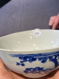 A Chinese blue and white bowl and a pair of cups and saucers, Kangxi