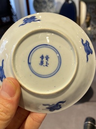 A Chinese blue and white bowl and a pair of cups and saucers, Kangxi