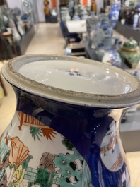 A pair of Chinese famille verte powder blue-ground vases and a fish bowl, 19th C.