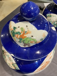 A pair of Chinese famille verte powder blue-ground vases and a fish bowl, 19th C.