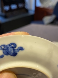 A Chinese blue and white bowl and a pair of cups and saucers, Kangxi