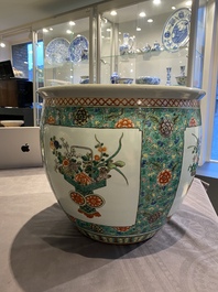 A pair of Chinese famille verte powder blue-ground vases and a fish bowl, 19th C.