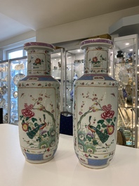 A pair of Chinese famille rose rouleau vases, 19th C.