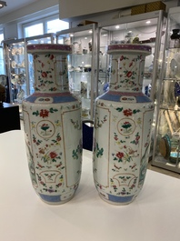 A pair of Chinese famille rose rouleau vases, 19th C.