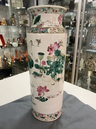 A Chinese famille rose rouleau vase with butterflies and cranes near a lotus pond, 19th C.