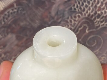 A Chinese white jade 'Eight horses of Mu Wang' snuff bottle, 18/19th C.