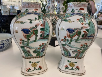 A Chinese famille verte four-piece 'mythical animals' garniture, Kangxi