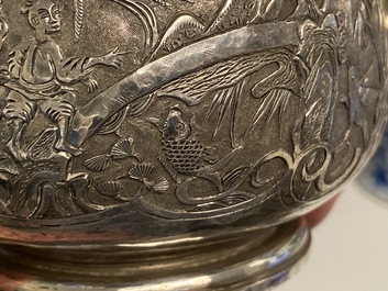 A Chinese silver teapot with birds among blossoming branches, 19th C.