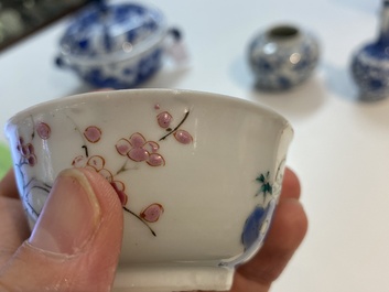 A Chinese famille rose cup and saucer with a couple on a terrace, Qianlong