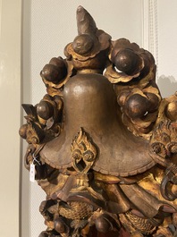 A large Chinese gilded and lacquered wooden reticulated Buddhist shrine, 17/18th C.