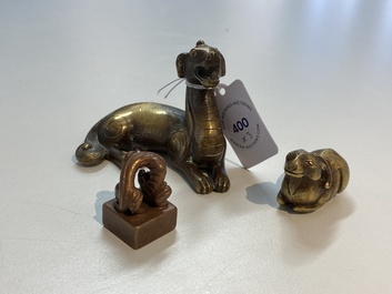 Two Chinese bronze scroll weights and a seal stamp, Qing