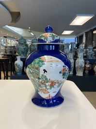 A pair of Chinese famille verte powder blue-ground vases and a fish bowl, 19th C.