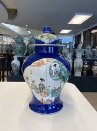 A pair of Chinese famille verte powder blue-ground vases and a fish bowl, 19th C.