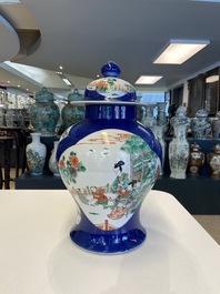 A pair of Chinese famille verte powder blue-ground vases and a fish bowl, 19th C.