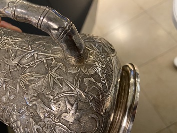 A Chinese silver teapot with birds among blossoming branches, 19th C.