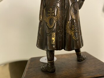 A Japanese patinated and gilded bronze figure of a warrior, signed Miyao, Meiji, 19th C.