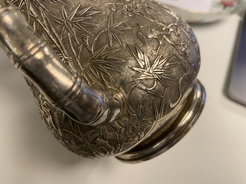 A Chinese silver teapot with birds among blossoming branches, 19th C.