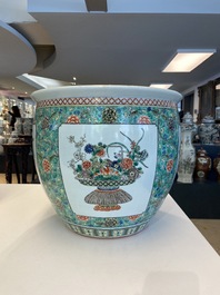 A pair of Chinese famille verte powder blue-ground vases and a fish bowl, 19th C.