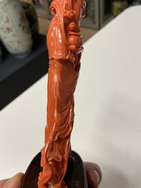 A Chinese carved red coral 'Guanyin' figure, 19/20th C.