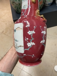 A pair of Chinese famille rose ruby-ground vases, 19th C.