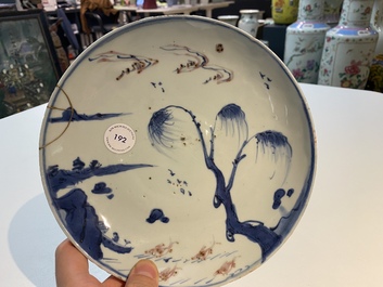 A Chinese blue, white and copper red ko-sometsuke 'fish' plate for the Japanese market, Transitional period